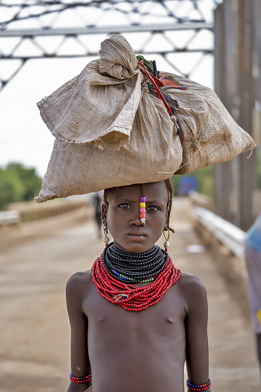 girl on Omo river bridge